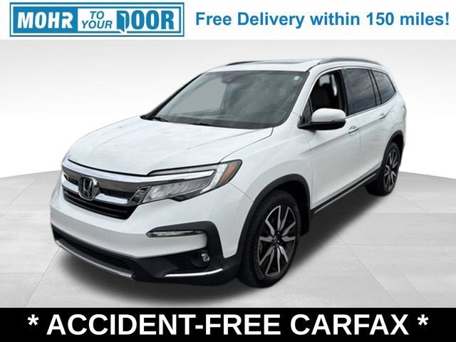 2021 Honda Pilot Touring 8-Passenger in White — front three-quarter view