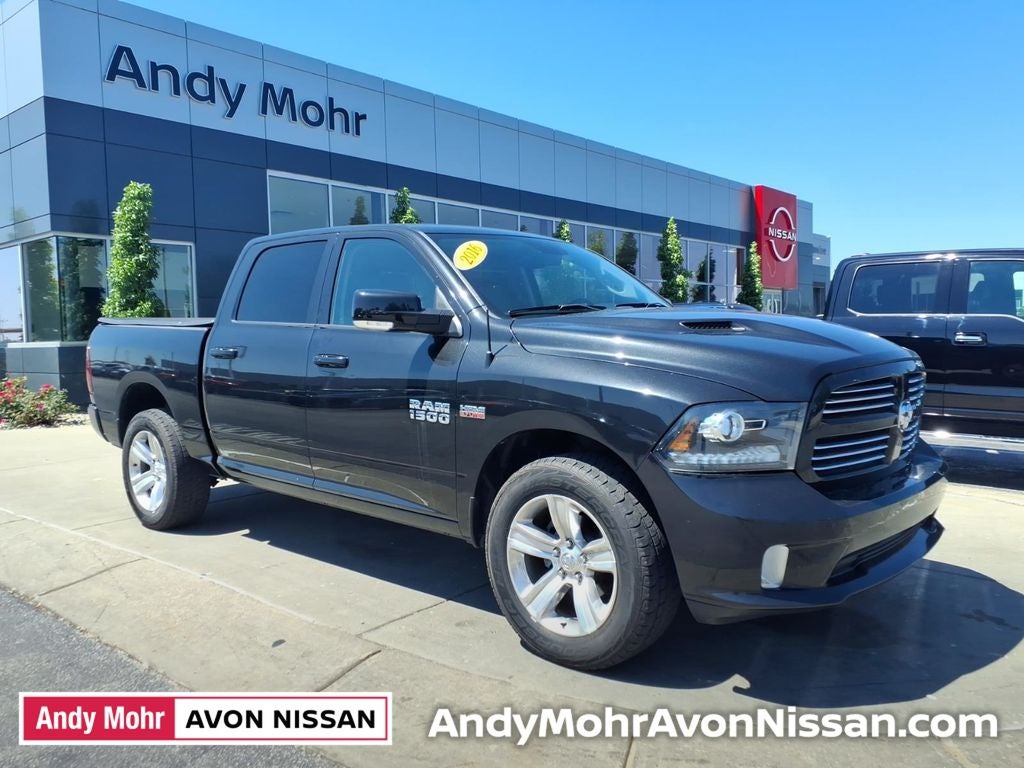 2016 RAM 1500 Sport in Brilliant Black Crystal Pearlcoat — front three-quarter view