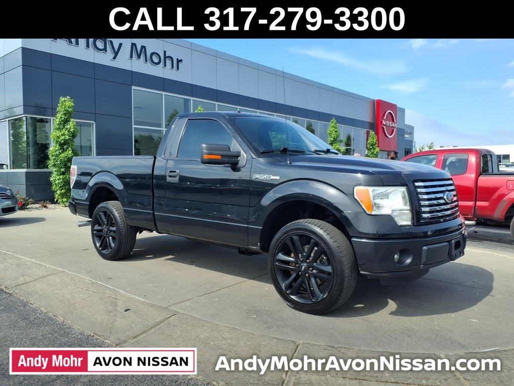 2011 Ford F-150 XLT in Tuxedo Black Metallic — front three-quarter view