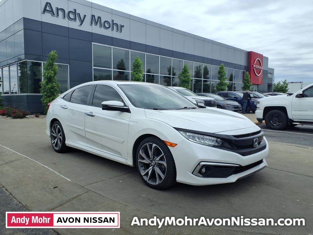 2019 Honda Civic Touring in White Orchid Pearl — front three-quarter view