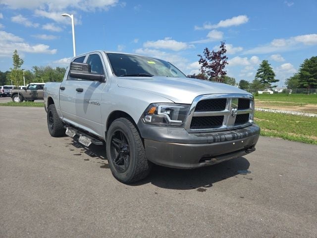 2011 RAM 1500 ST in Bright Silver Metallic — front three-quarter view